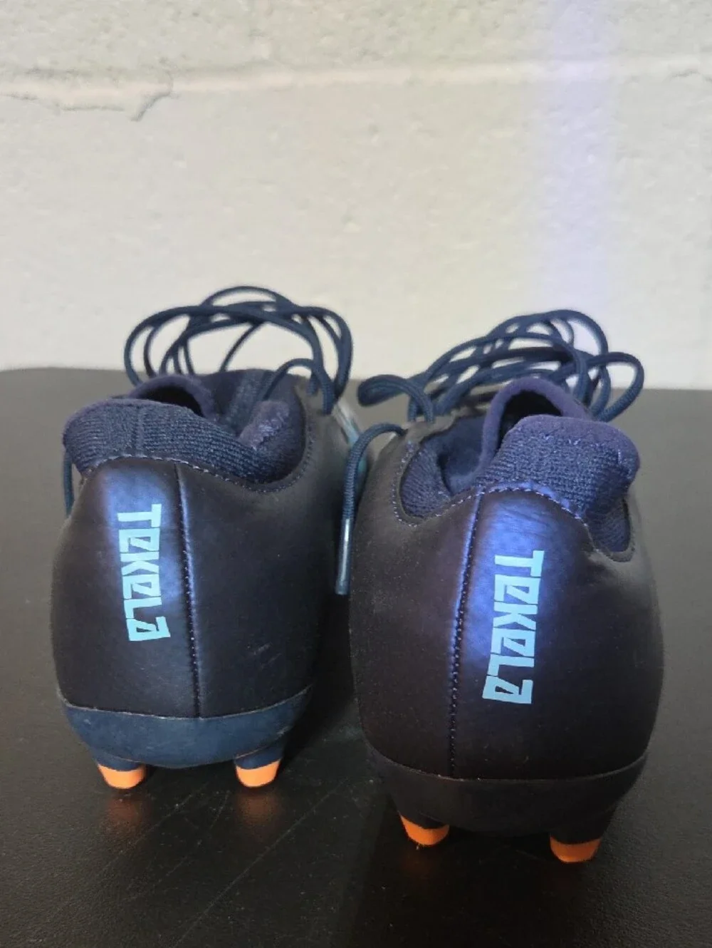 New Balance Men’s Navy Soccer Cleats with Light Blue Logo and Orange Studs